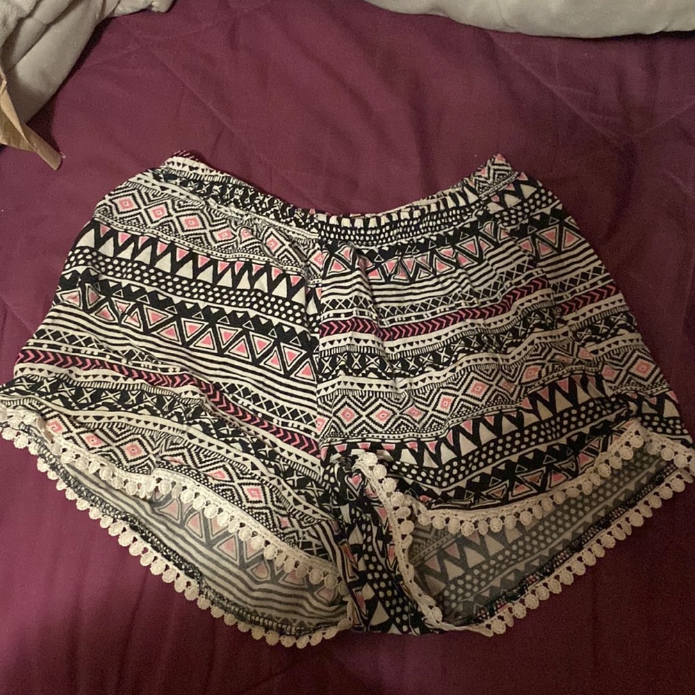 Pink black and white patterned kids shorts.